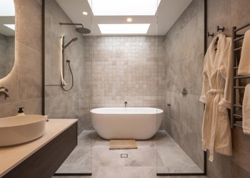 Fully Tiled Bathroom With Freestanding Bath