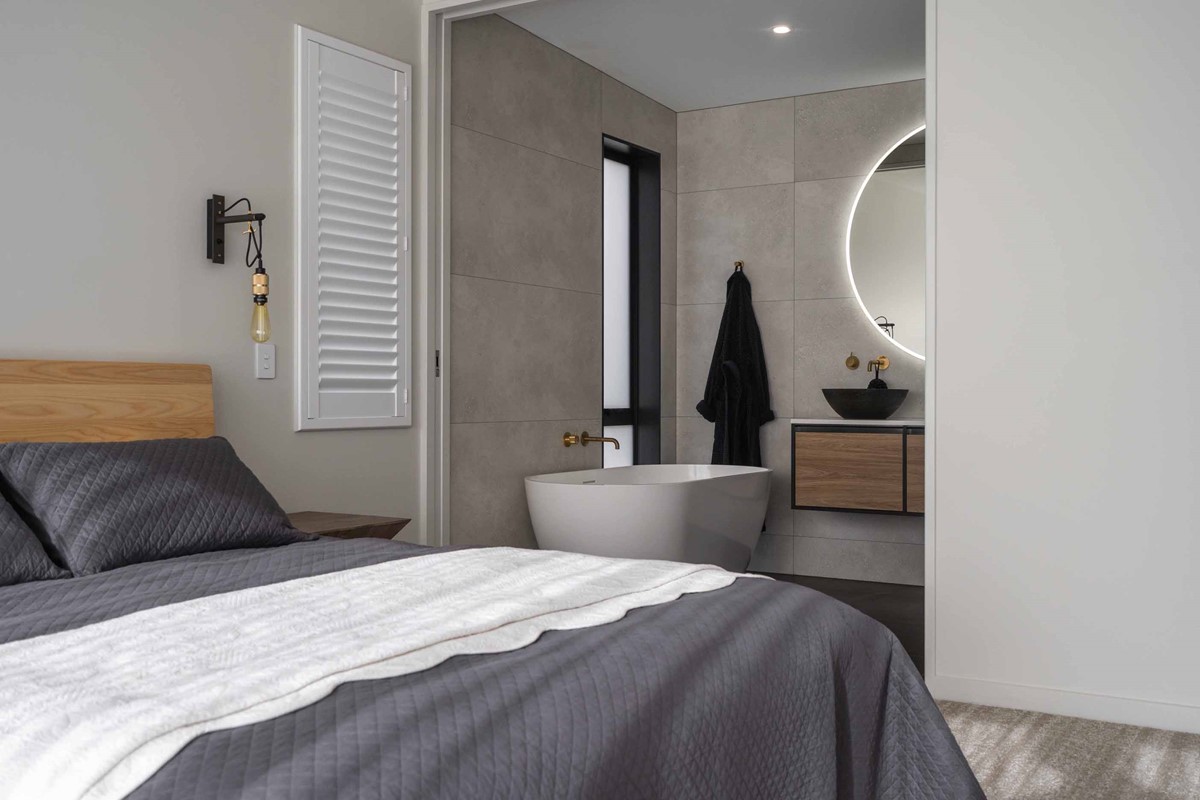 Tony & Janie's Master Bedroom consists of a large sliding cavity door leading to their ensuite which can be left open to create a larger area or closed for privacy.