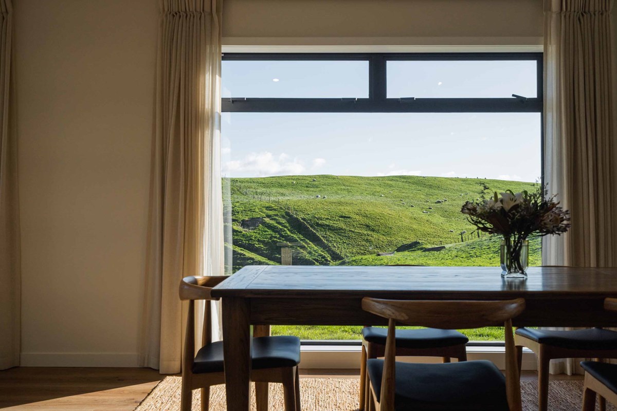 The dining room view which can also be seen from throughout the home with large windows and doors throughout. Creating a light and open atmosphere to make the most of the Hawkes Bay sun.