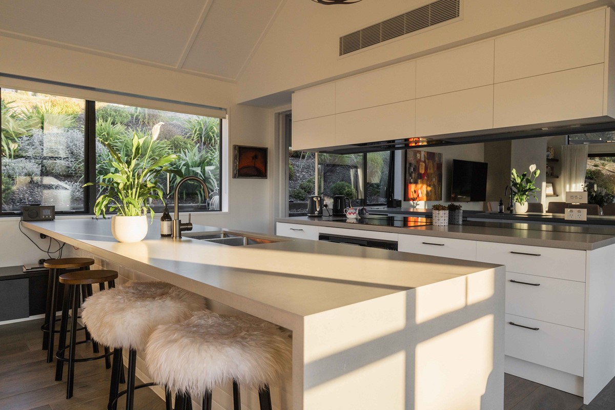 Another beautiful spot within Neil & Fleur's new home, their kitchen with a large island bench. Perfect for entertaining and being a part of the social atmosphere while still being able to cook in the kitchen.