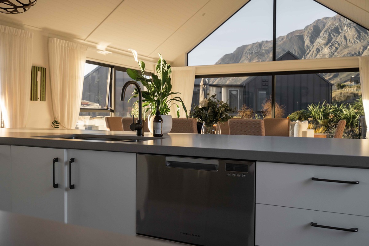 A snapshot from within the kitchen, showing how easy it is for Neil & Fleur to entertain in the living and dining from in the kitchen. The stunning view of the Remarkables can also be seen from the kitchen.