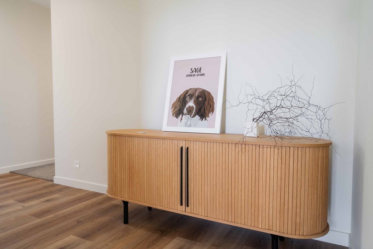 At the entrance of Laura & Shaun's home, you will see this beautiful slatted oak sideboard which compliments the timber features throughout the home. A very cute illustration of their very cute dog, Sage, is also a highlight for visitors.