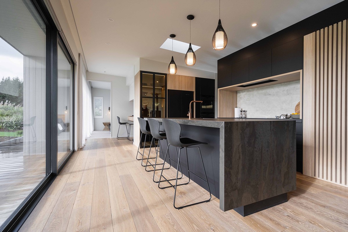 Tony & Janie's beautiful kitchen, much like the exterior, does not fail to impress their guests. Contrasting dark and light features, with a scullery behind, Tony & Janie both mention the kitchen to be one of their favourite parts to their new home.