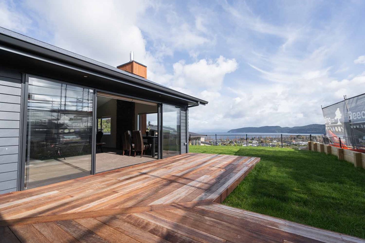 Kasey & Sindre both love the stunning view of Lake Taupō from their new kitchen dining and lounge area.